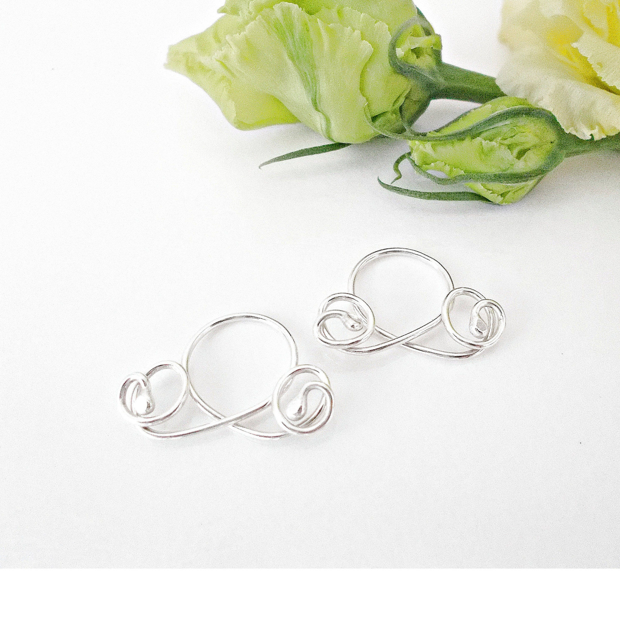 Handmade silver non-piercing nipple rings with elegant loop and swirl design. Adjustable fit, comfortable wear, sold as a matching pair — Image 3 of 6